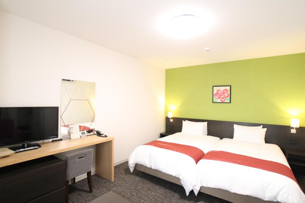 Postel nebo postele na pokoji v ubytování Hotel Gran Ms Kyoto