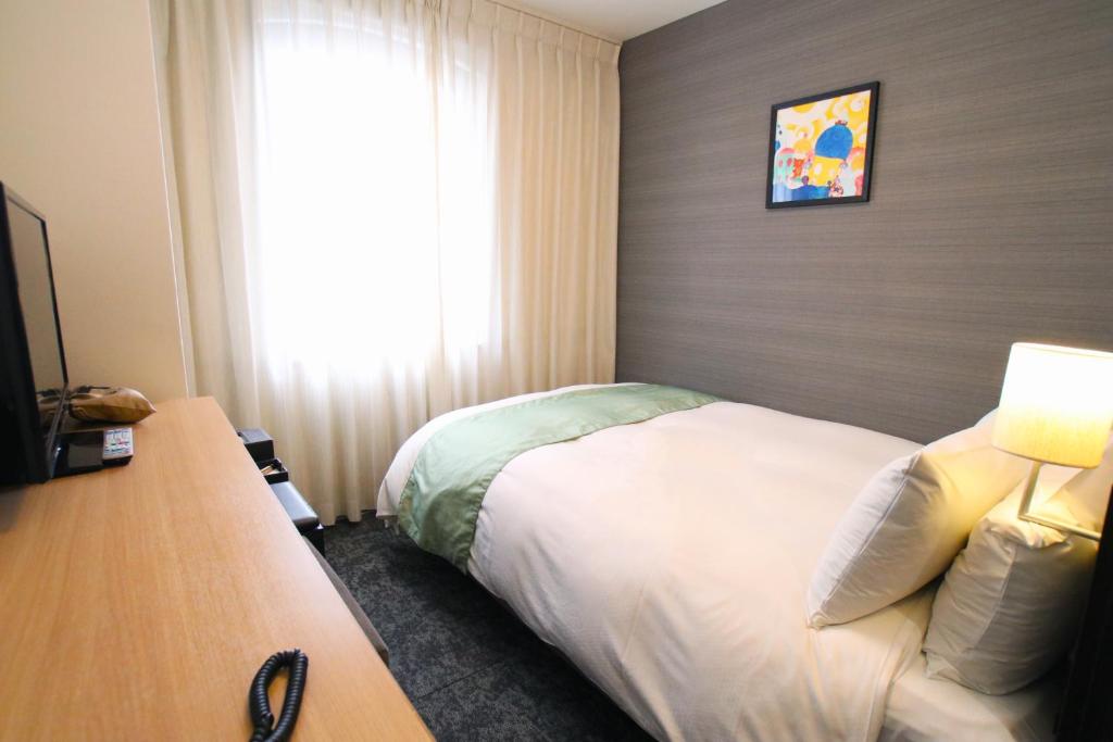 Postel nebo postele na pokoji v ubytování Hotel Gran Ms Kyoto