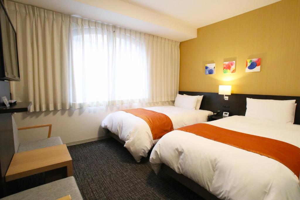 Postel nebo postele na pokoji v ubytování Hotel Gran Ms Kyoto