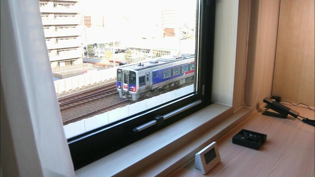 TV a/nebo společenská místnost v ubytování JR Clement Inn Kochi
