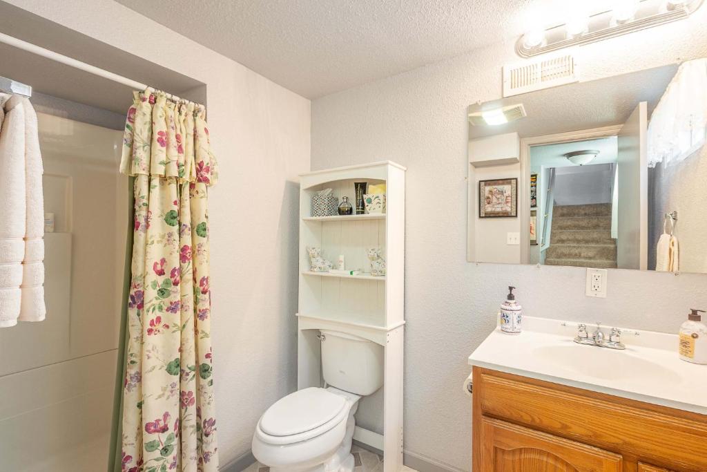 a bathroom with a toilet and a sink at Duplex in Alberta Art District in Portland