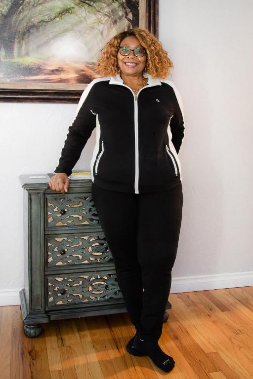 a woman is standing next to a dresser at Duplex in Alberta Art District in Portland