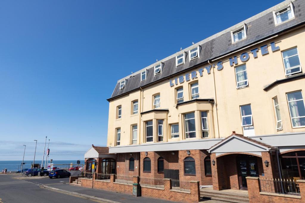 a large building on the side of a street at The Caledonian Tower Hotel in Blackpool