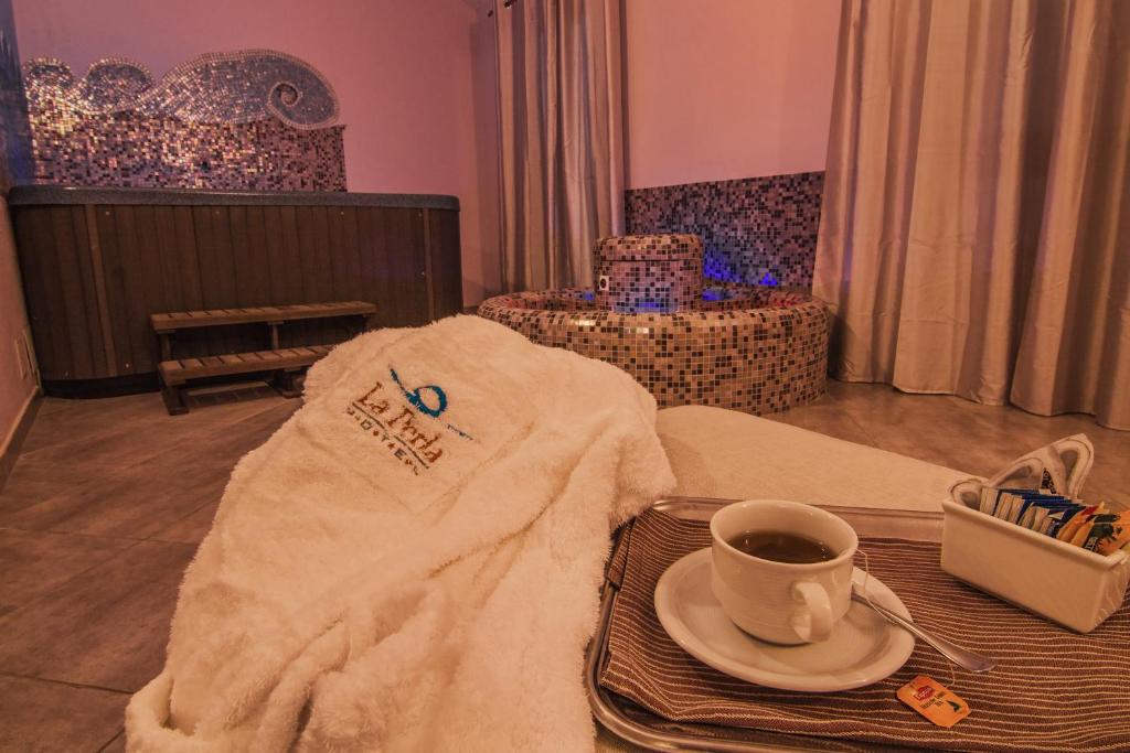 Postel nebo postele na pokoji v ubytování Hotel La Perla