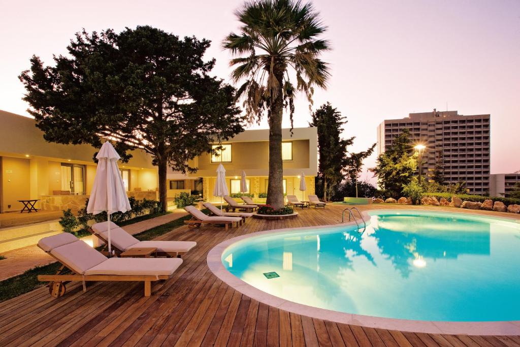 Bazén v ubytování Rodos Palace Hotel nebo v jeho okolí