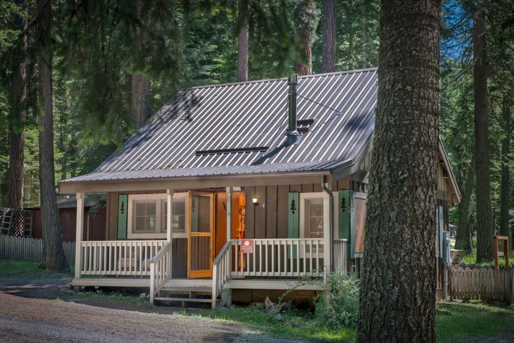a small house in the middle of a forest at Backcountry Bungalow in Joseph