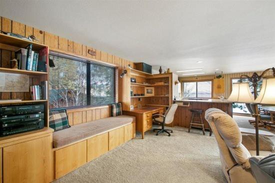 a living room with a desk and a desk at The Treehouse in Joseph