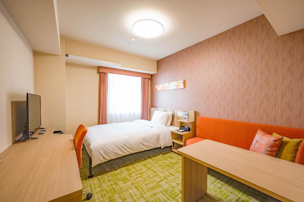 TV a/nebo společenská místnost v ubytování Tabino Hotel lit Matsumoto Milky white Onsen