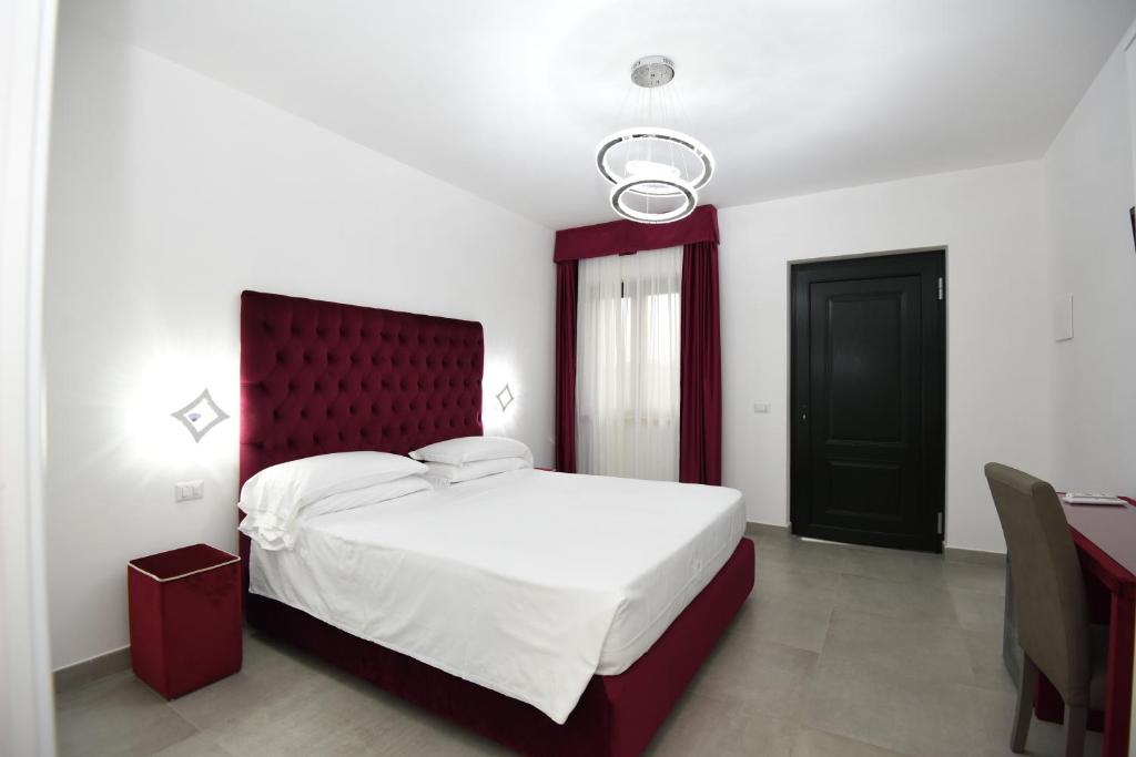 Postel nebo postele na pokoji v ubytování Agriturismo Borgo Imperiale