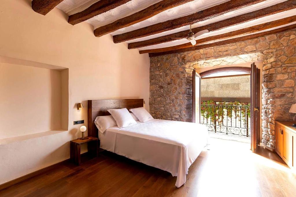 Posteľ alebo postele v izbe v ubytovaní Casa Gran 1771 - MontRubí Winery Hotel - Adults Only