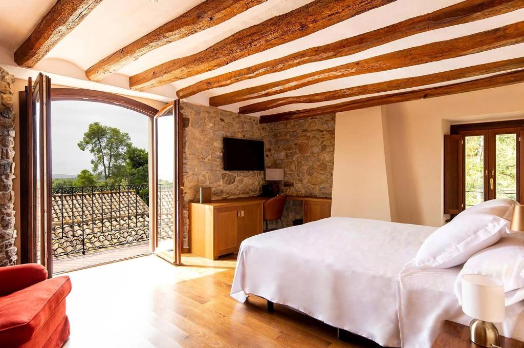 Posteľ alebo postele v izbe v ubytovaní Casa Gran 1771 - MontRubí Winery Hotel - Adults Only