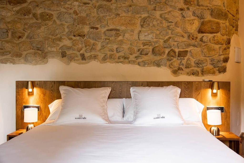 Posteľ alebo postele v izbe v ubytovaní Casa Gran 1771 - MontRubí Winery Hotel - Adults Only