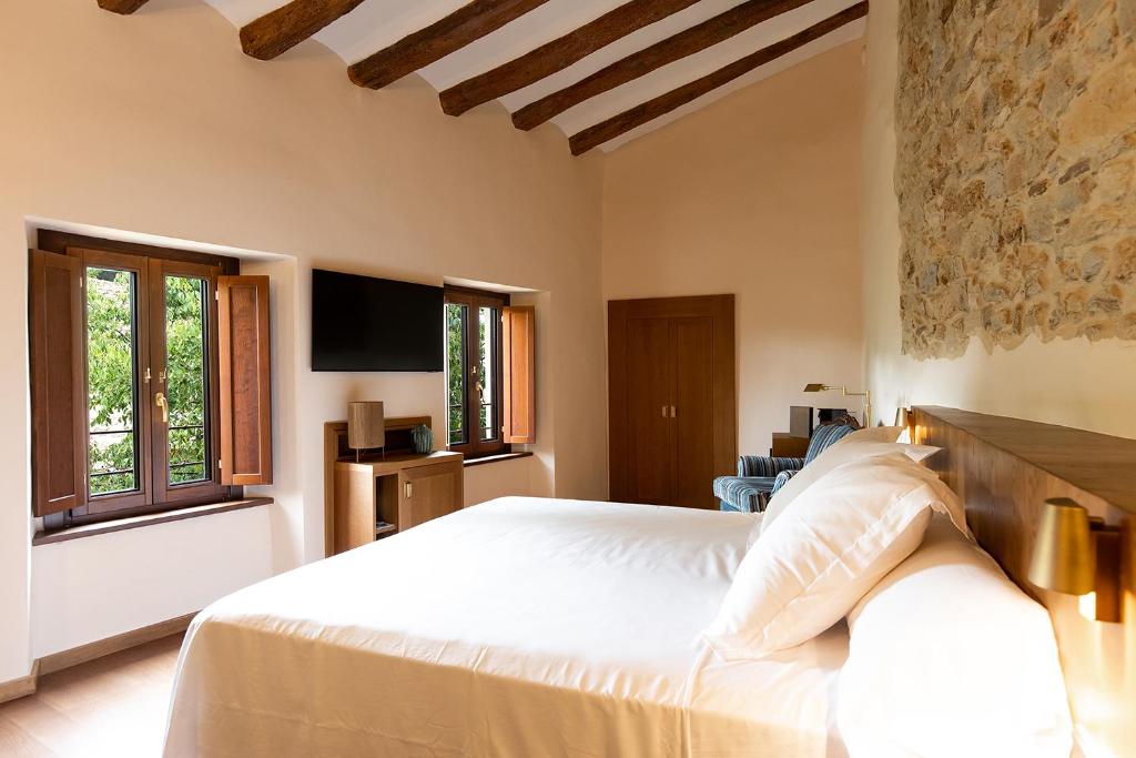 Posteľ alebo postele v izbe v ubytovaní Casa Gran 1771 - MontRubí Winery Hotel - Adults Only