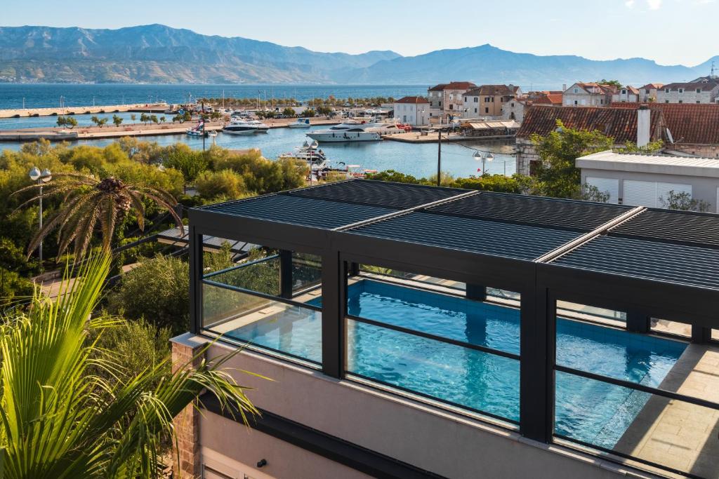 a view of a building with solar panels on the roof at Hotel Osam - Adults Only in Supetar