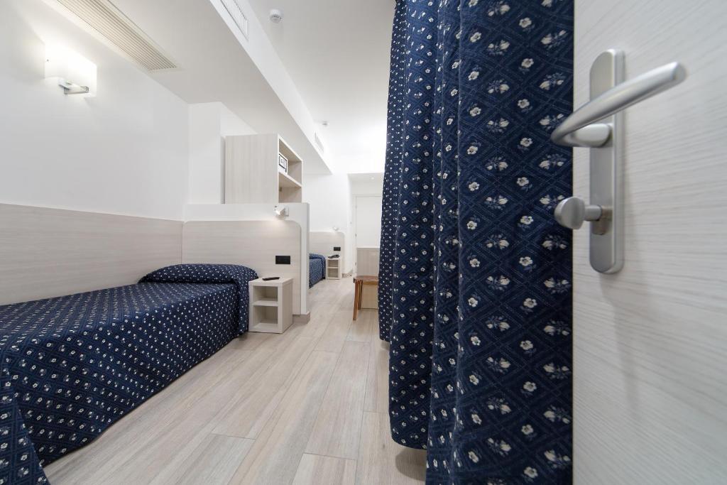 Postel nebo postele na pokoji v ubytování Hotel Giotto