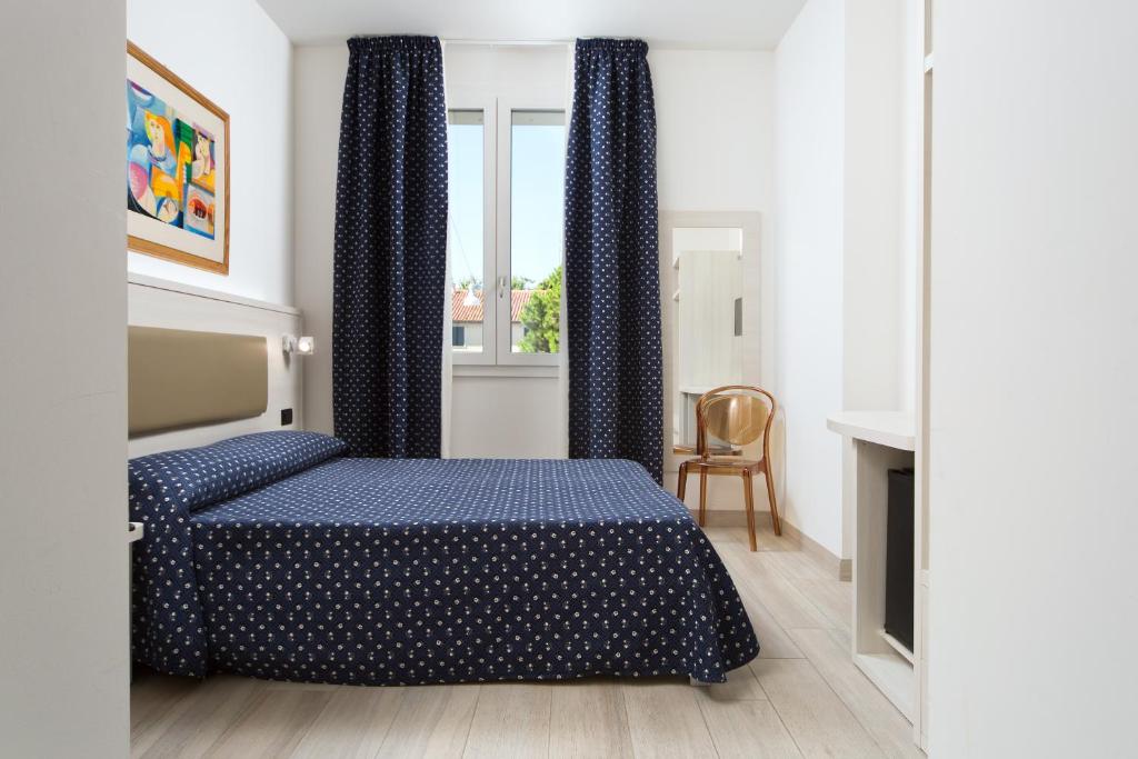 Postel nebo postele na pokoji v ubytování Hotel Giotto