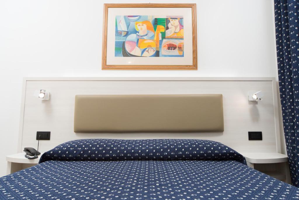 Postel nebo postele na pokoji v ubytování Hotel Giotto