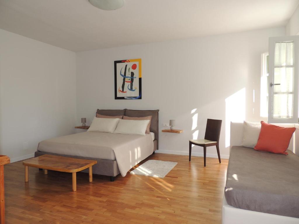 Postel nebo postele na pokoji v ubytování Ginkgo Guest House