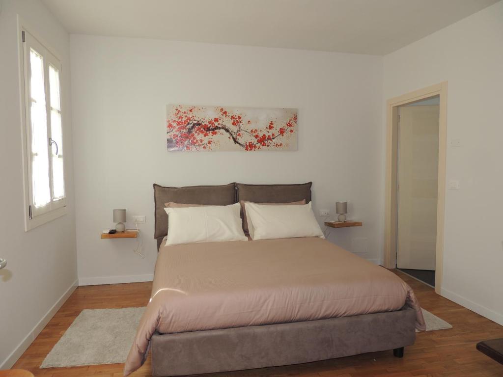 Postel nebo postele na pokoji v ubytování Ginkgo Guest House