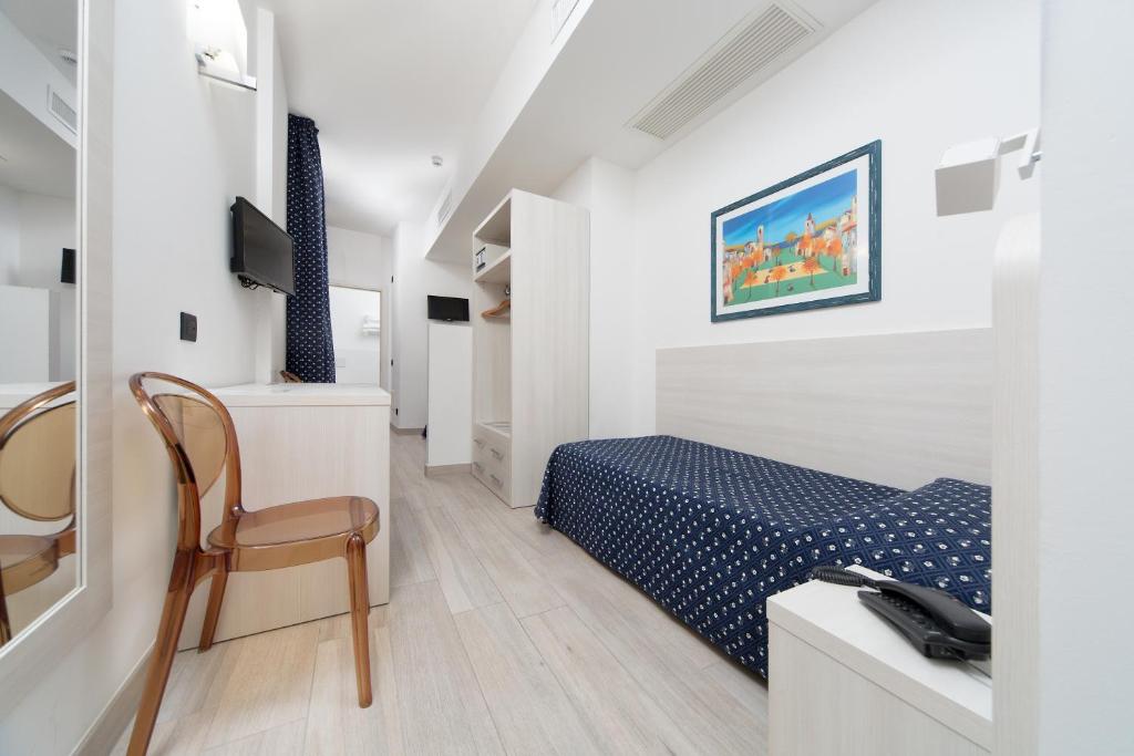 Postel nebo postele na pokoji v ubytování Hotel Giotto