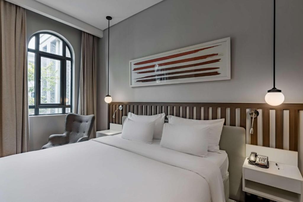 Ένα ή περισσότερα κρεβάτια σε δωμάτιο στο Radisson Lagos Ikeja
