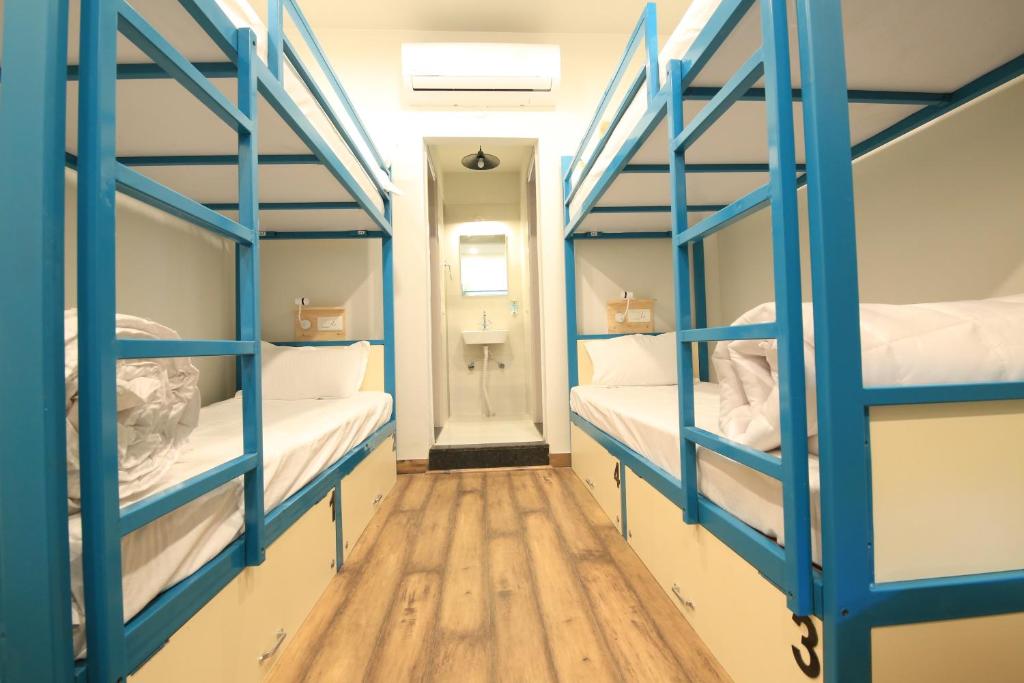 Postel nebo postele na pokoji v ubytování Blue Beds Hostel