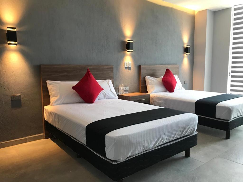 Postel nebo postele na pokoji v ubytování Hotel y Spa Posada Mirador