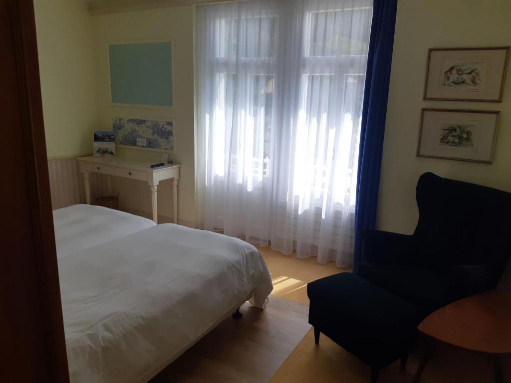 Postel nebo postele na pokoji v ubytování Hotel Regina