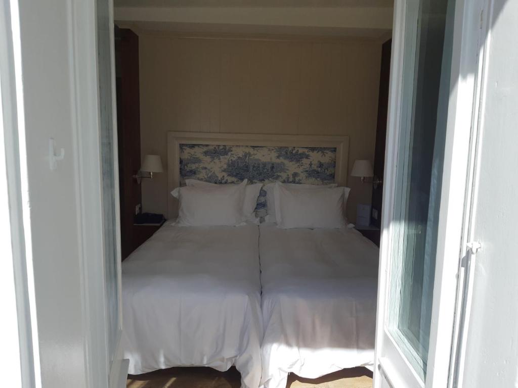 Postel nebo postele na pokoji v ubytování Hotel Regina