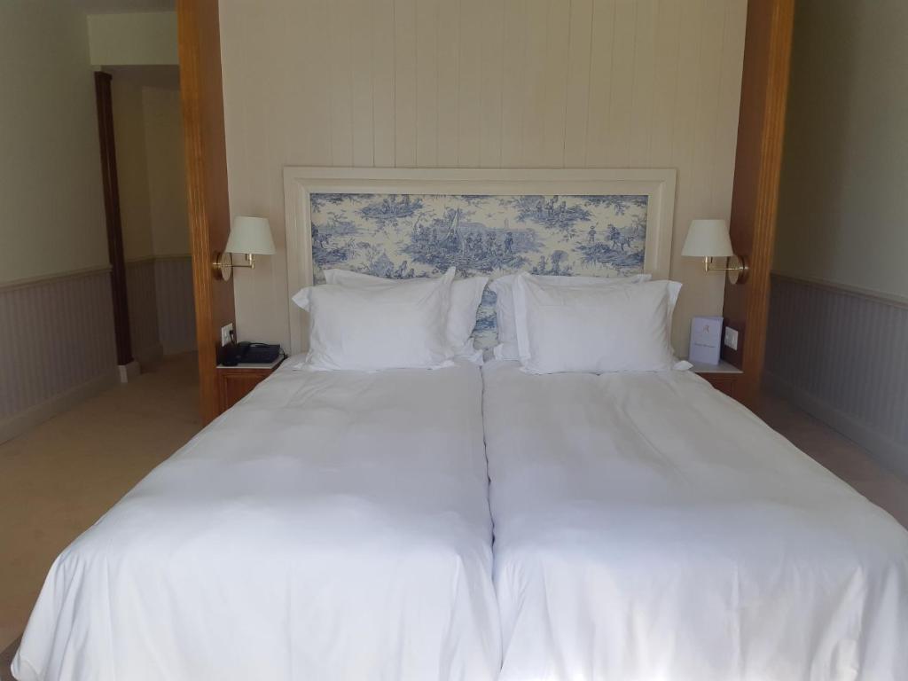 Postel nebo postele na pokoji v ubytování Hotel Regina