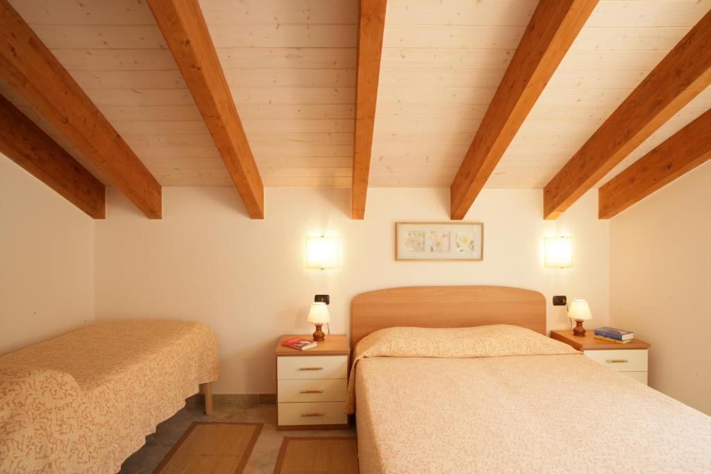 Кровать или кровати в номере Appartamenti In Piazzetta