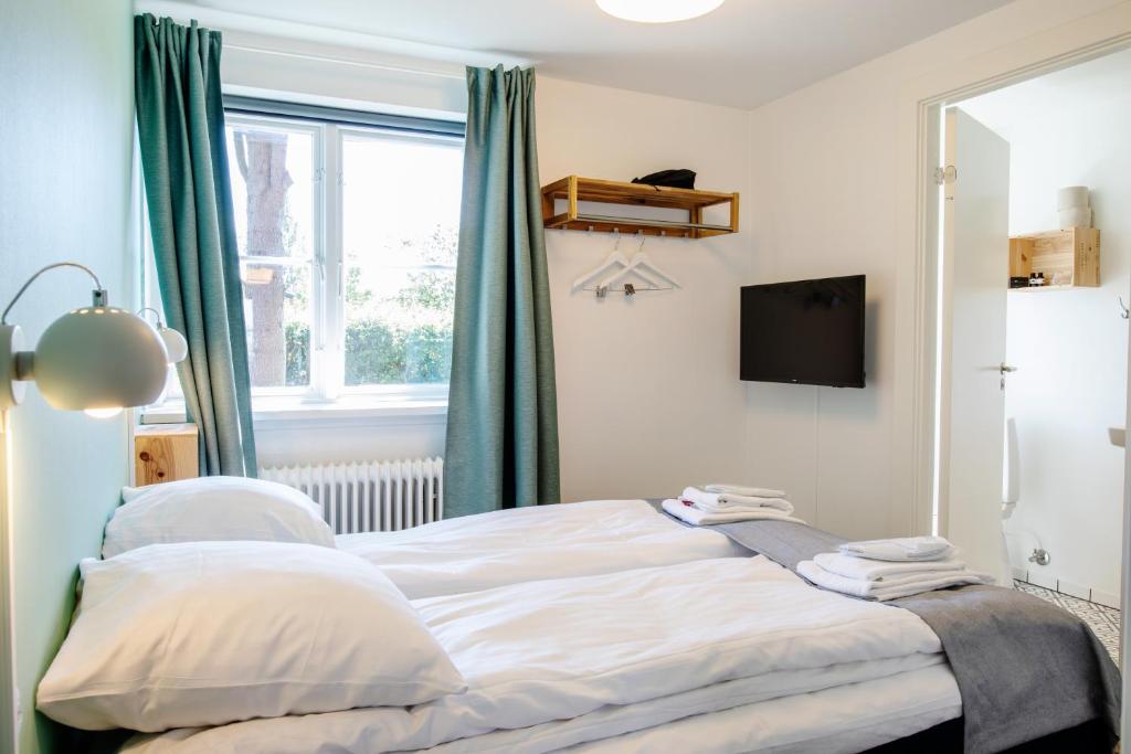 Postel nebo postele na pokoji v ubytování Kridthuset Stevns Klint