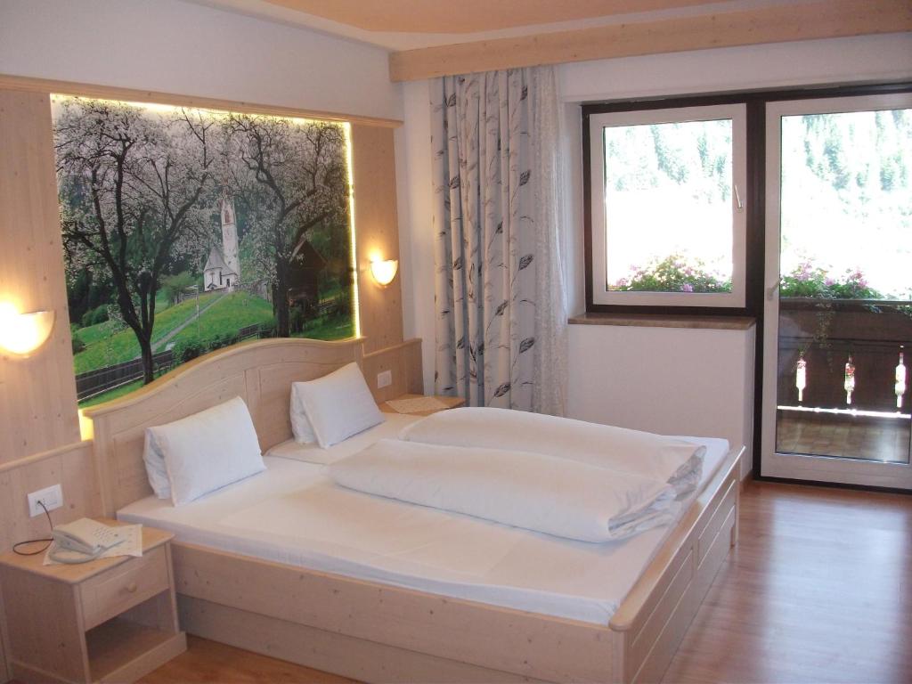 Postel nebo postele na pokoji v ubytování Hotel Schwarzbachhof