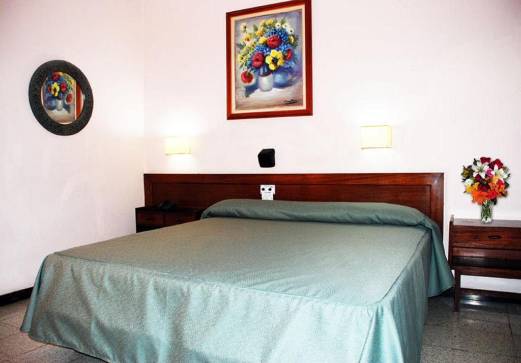Posteľ alebo postele v izbe v ubytovaní Hotel Olympia
