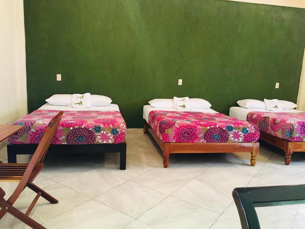 Postel nebo postele na pokoji v ubytování Hotel Maya Balam