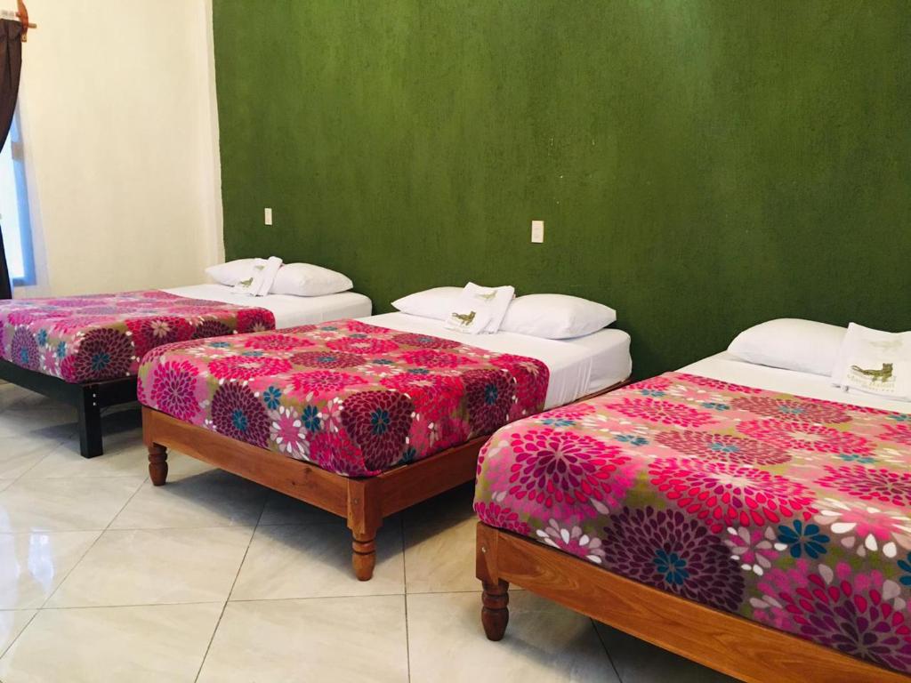 Postel nebo postele na pokoji v ubytování Hotel Maya Balam