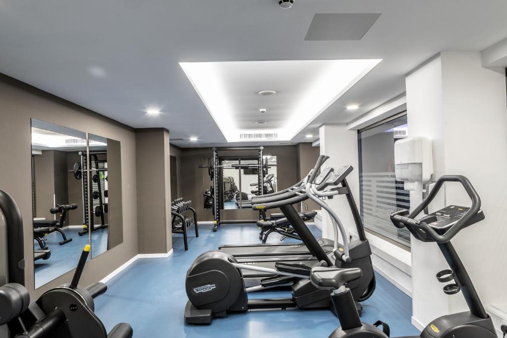 a gym with treadmills and elliptical machines at Faros Hotel Ayia Napa in Ayia Napa