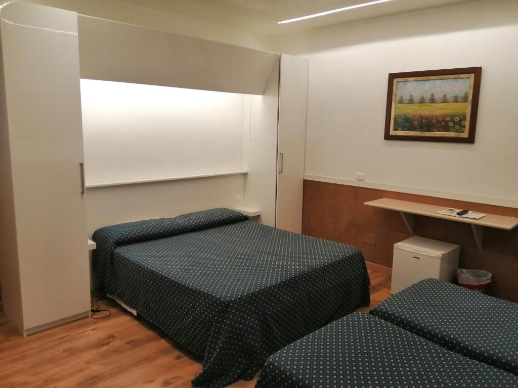 Posteľ alebo postele v izbe v ubytovaní Hotel Verona Rome