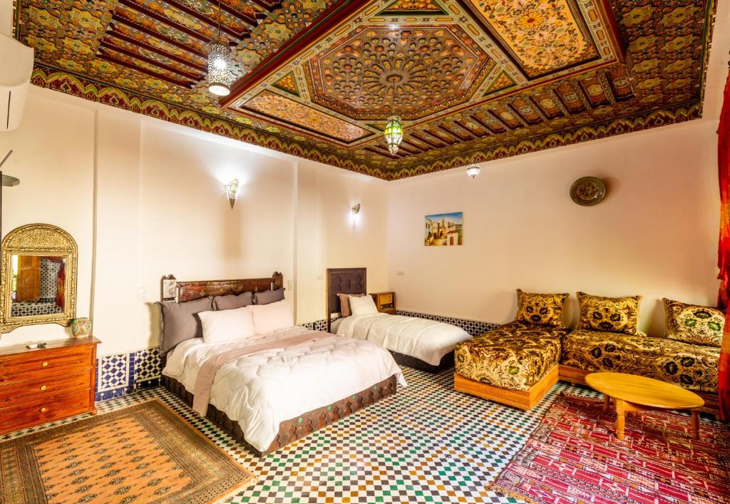 Llit o llits en una habitació de Riad Sayeda Al Hora