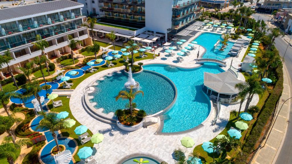 an overhead view of a pool at a resort at Faros Hotel Ayia Napa in Ayia Napa