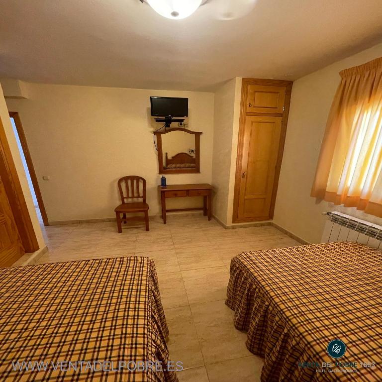 Łóżko lub łóżka w pokoju w obiekcie Hotel Venta del Pobre