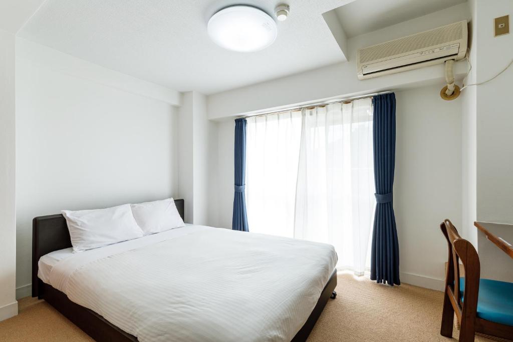 Postel nebo postele na pokoji v ubytování Hotel WWJ