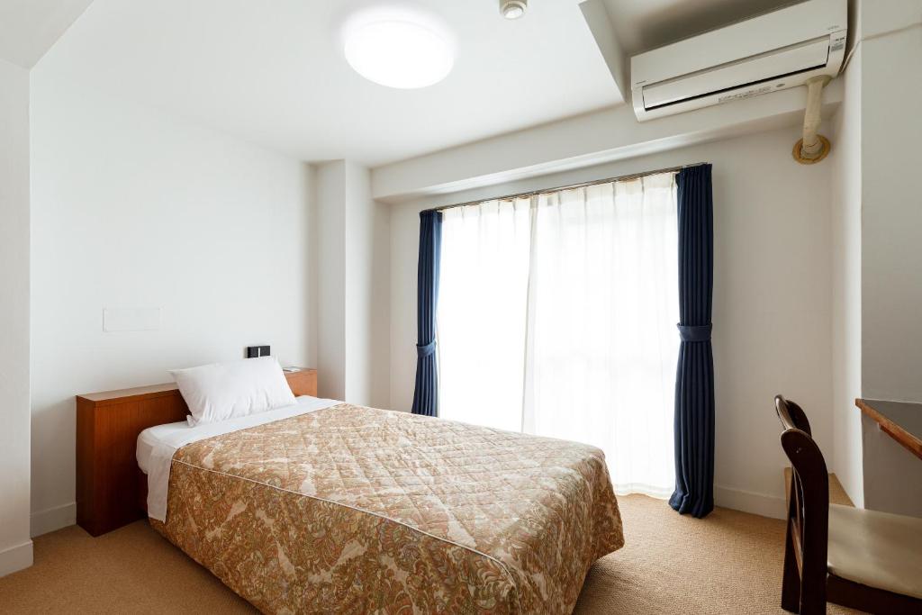 Postel nebo postele na pokoji v ubytování Hotel WWJ
