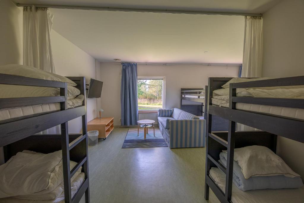 Postel nebo postele na pokoji v ubytování Systemairhallen Bed&Breakfast