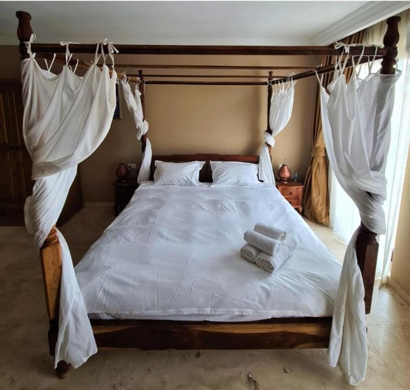 Postel nebo postele na pokoji v ubytování Kaleidoscope Boutique Hotel