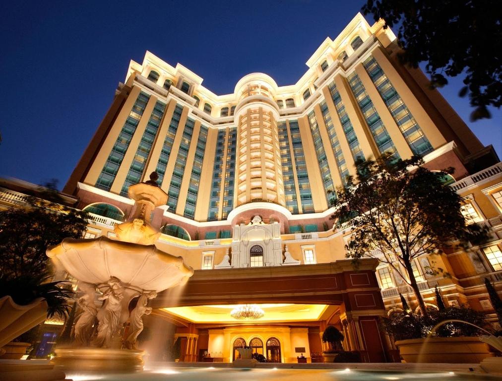 a large building with a fountain in front of it at Four Seasons Hotel Macao, Cotai Strip in Macau