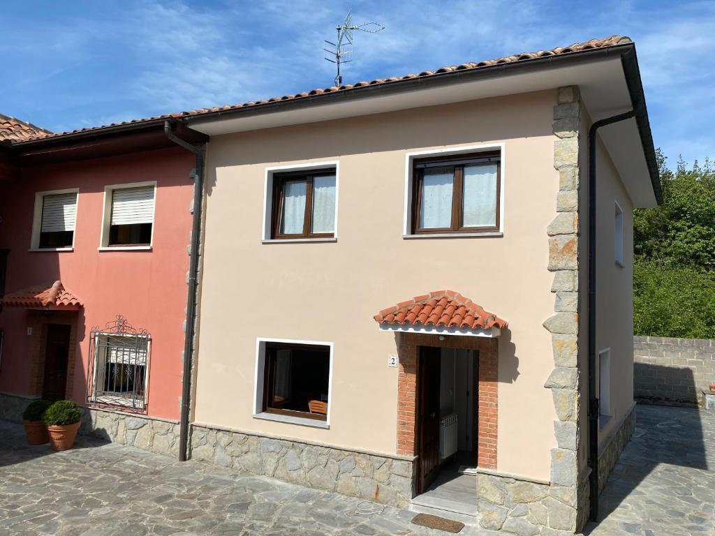 a large house with a building at Las tres Luces Casa 2 in Picones