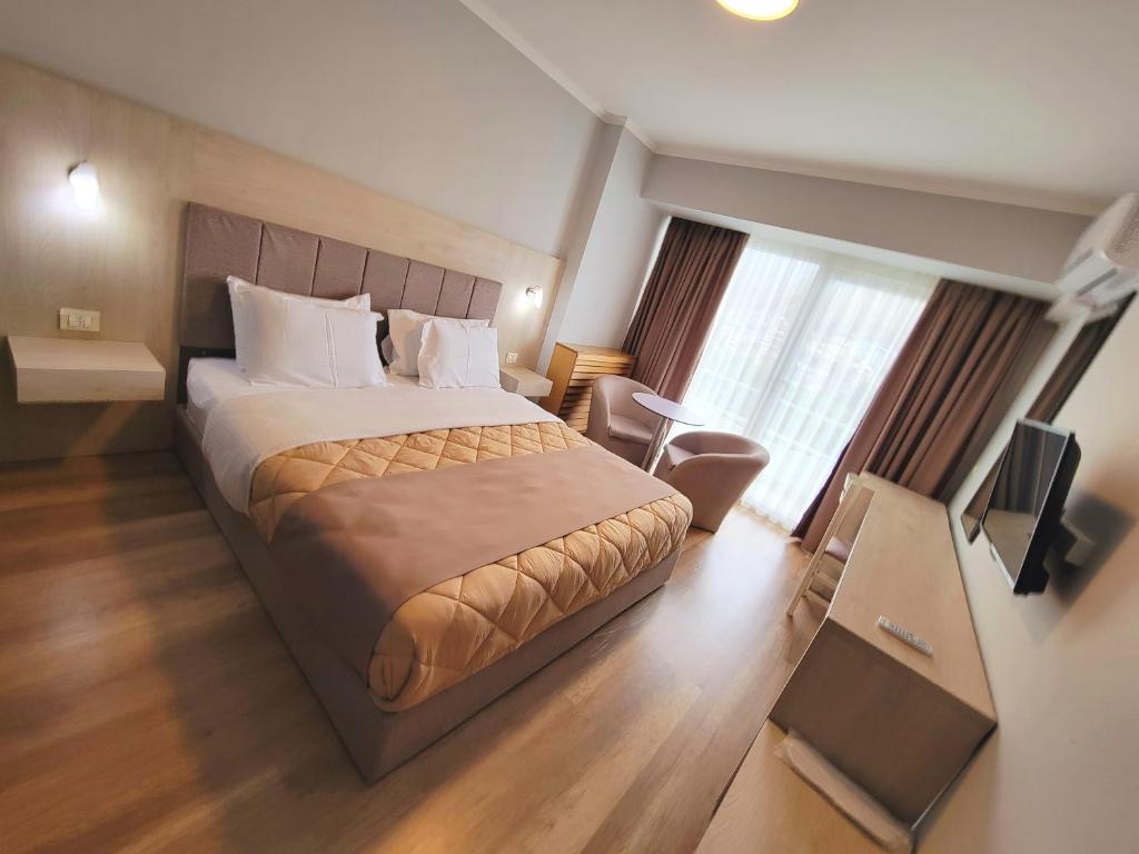 Katil atau katil-katil dalam bilik di Hotel Enkelana