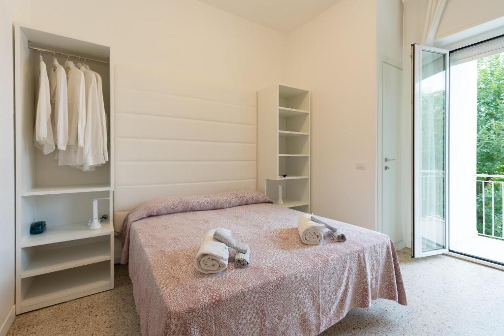 Postel nebo postele na pokoji v ubytování Hotel Ninfea Cattolica