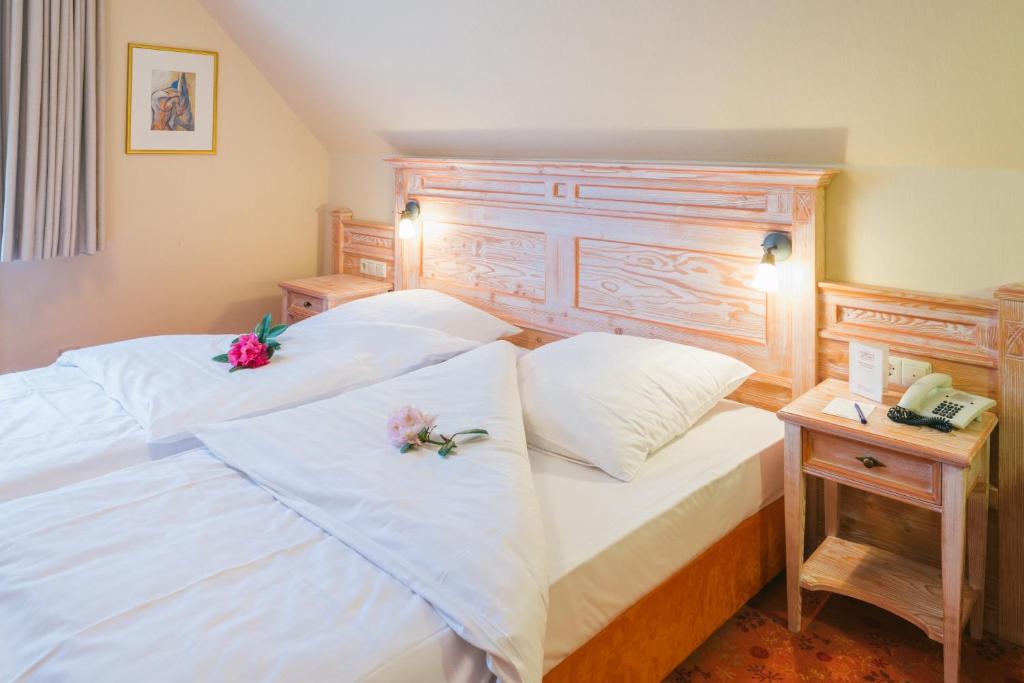 Postel nebo postele na pokoji v ubytování Hotel Landhaus Höpen